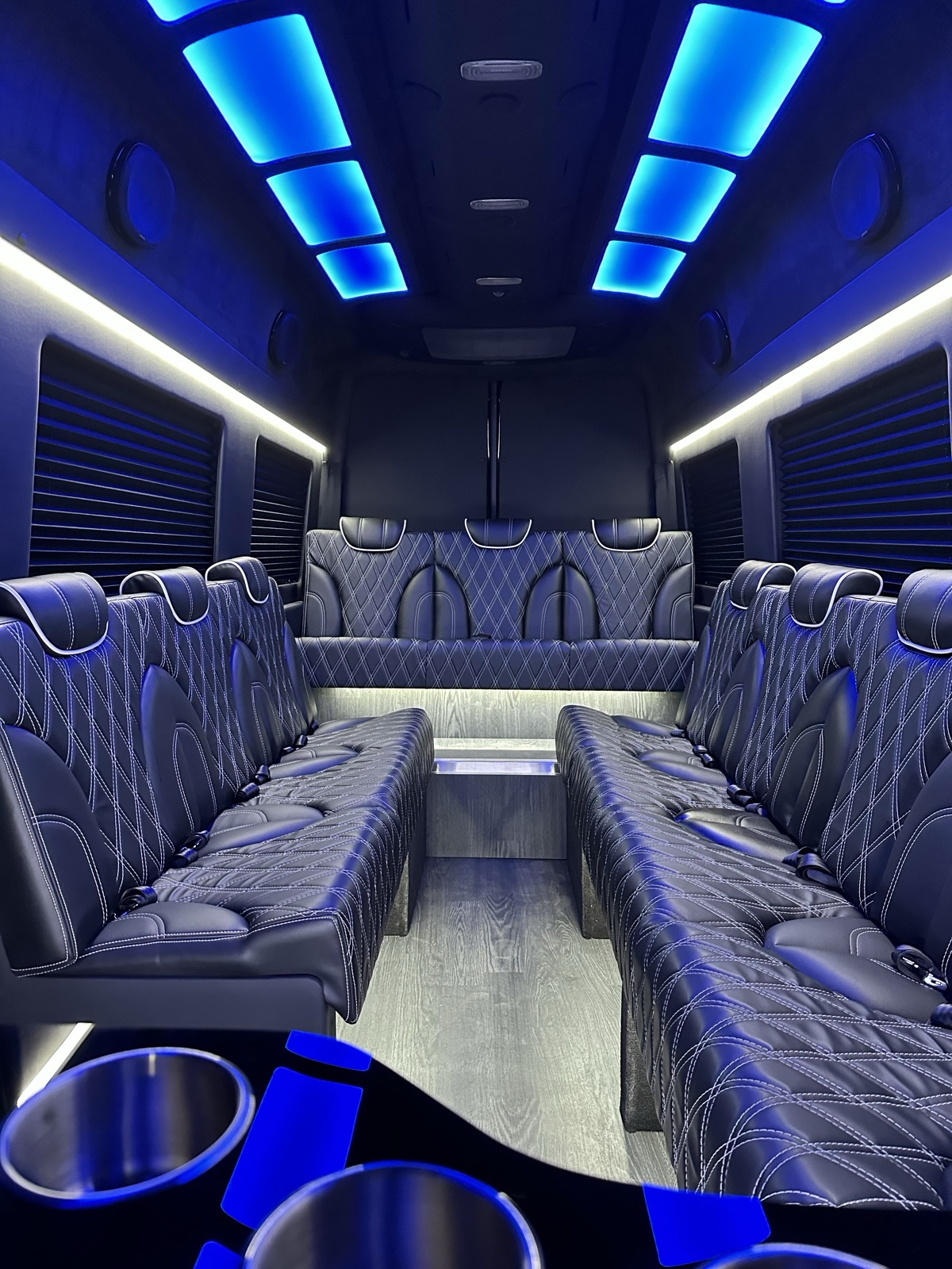 Limousine Sprinter wraparound leather seating with blue lighting