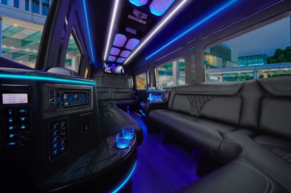 VIP Sprinter lounge with leather seating and blue LED lighting