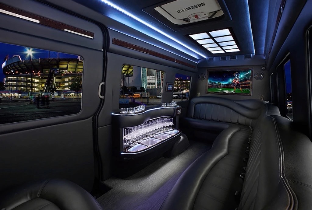 VIP Sprinter cabin with a lighted bar and flat-screen TV